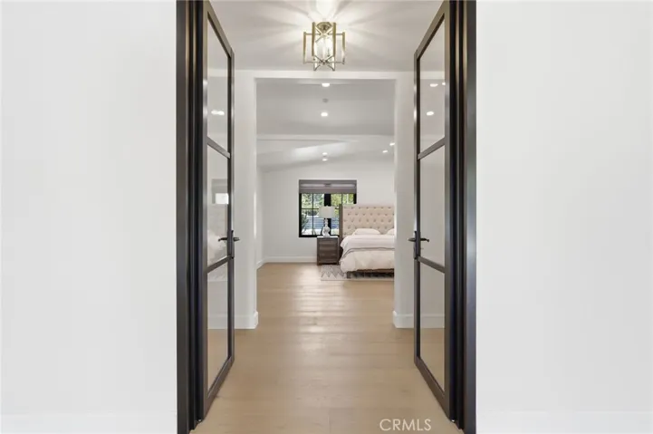 Bedroom 4 dual glass door entryway