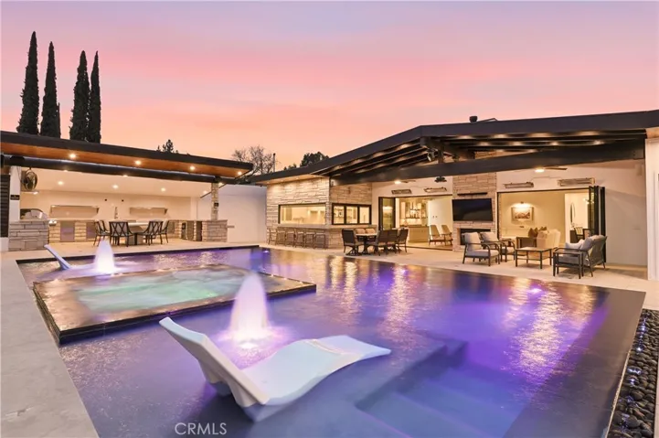 Entertainers backyard with app controlled pool features & lighting!