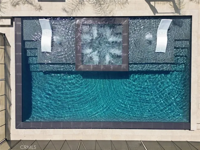 Matching baja shelves & steps leading into the pool on either side. Pool is 5 feet deep and made for swimming or lounging (no diving).
