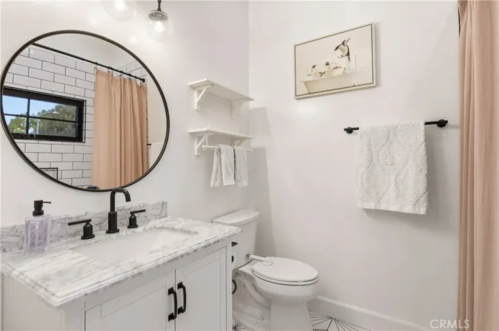 Bedroom 1 features a full bathroom with a 6-foot jetted soaking tub