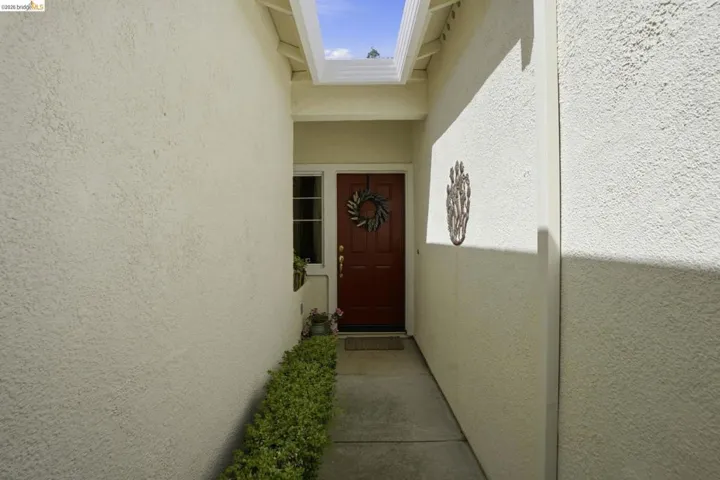 View of exterior entry with stucco siding