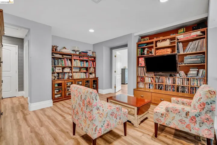 Sitting room featuring light wood-style flooring and recessed lighting