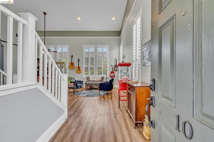 Foyer entrance featuring light wood-type flooring, plenty of natural light, and recessed lighting