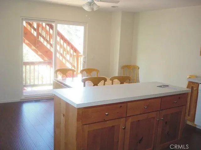 Main floor kitchen with dining area and deck.