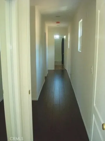 Top floor with 3 bedrooms and 2 full baths. Hallway shown.