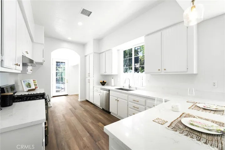 Make 66 a DONE DEAL with this rare one story remodeled and upgraded home.
