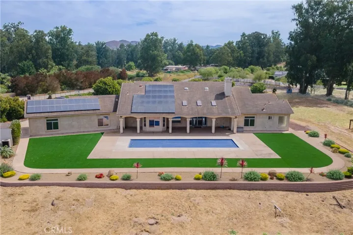 Elevated pool area looks out over the property