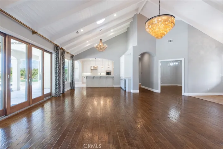 Incredible living space opens to the kitchen and the patio/pool area