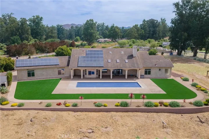 Elevated pool area looks out over the property