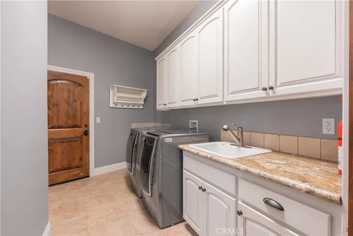 Organization is a breeze with all the storage and counter space in the laundry