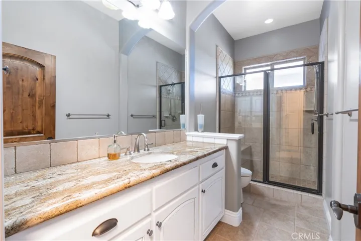 Just off the laundry, this bathroom is great for access from the pool or a first stop coming in from the yard