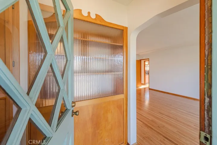 Front formal entry with arched entry to living area