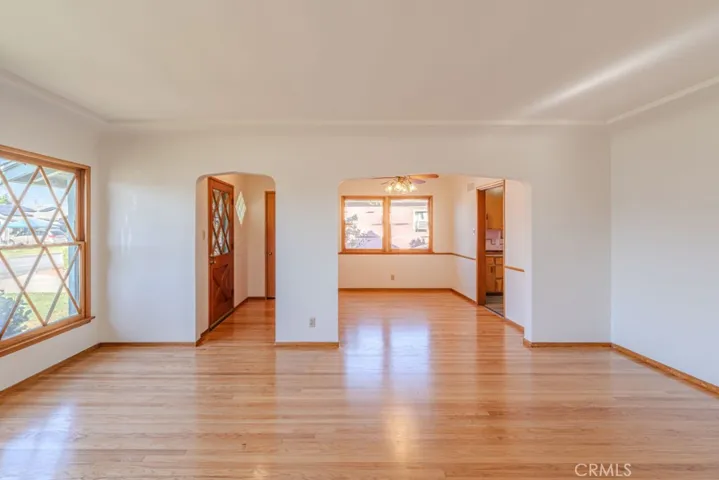 Living room view to entry and formal dining room
