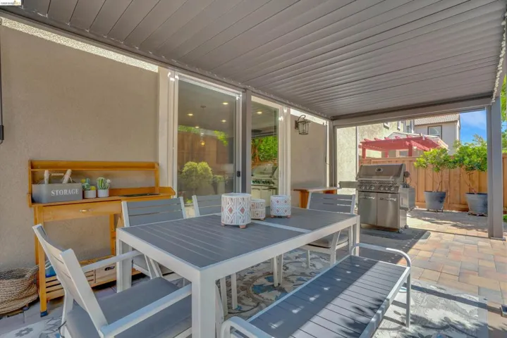 View of patio featuring outdoor dining space and grilling area