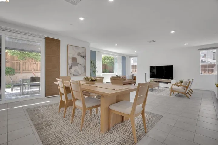 Dining space featuring plenty of natural light, light tile patterned floors, and recessed lighting