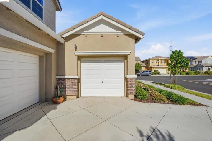 Garage with a residential view and driveway