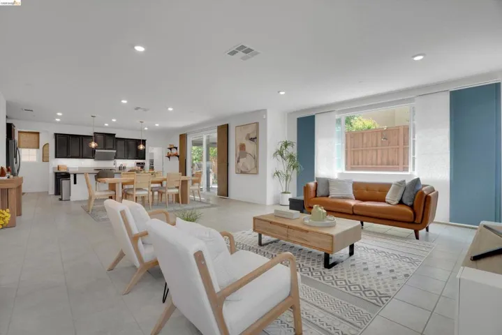 Living room with plenty of natural light and recessed lighting