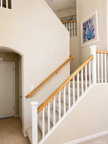 Staircase to 3 upstairs bedrooms/office