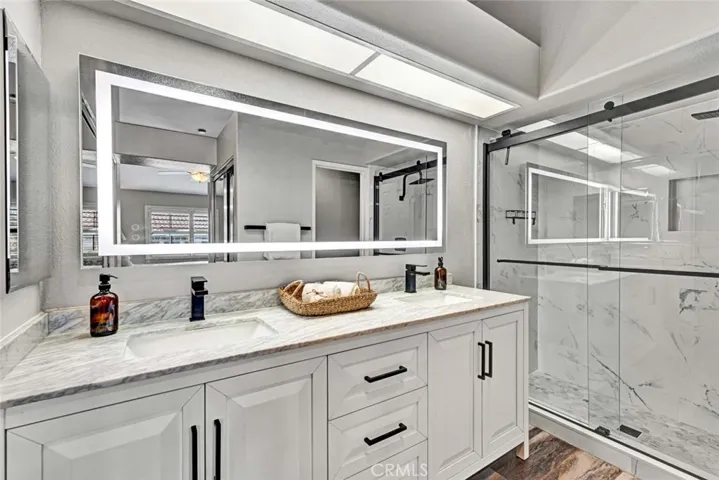 Remodeled primary bathroom with walk-in shower