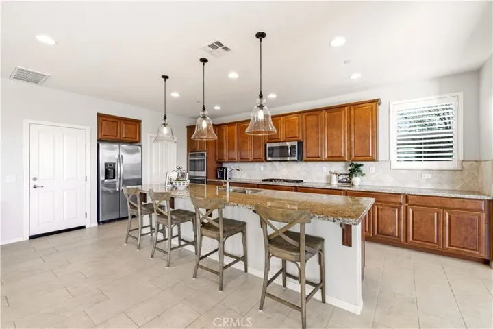 kitchen with oversized island and walk in pantry