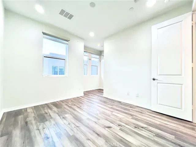 Secondary bedroom with automatic blinds, walk-in closet and separate full bath.