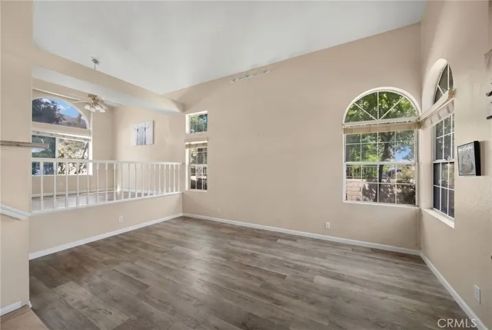 Livingroom and raised Formal dining room AI has removed furniture and personal items for Tenants privacy.