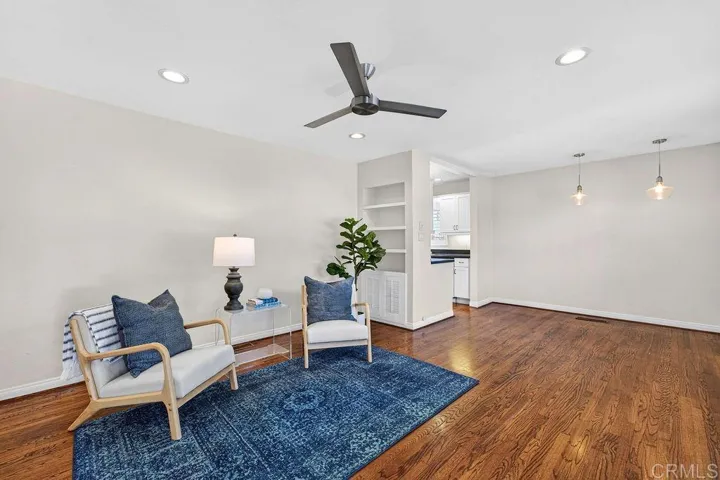 Living room features gleaming hardwood floors and recessed lighting!