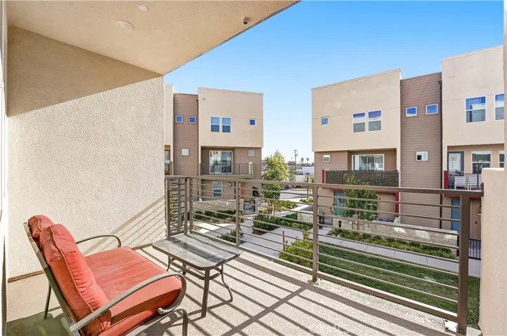 BALCONY OVERLOOKING THE COURTYARD.