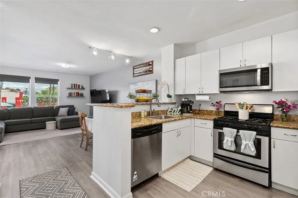 Entry with open concept Kitchen, dining and Living Room - upgraded flooring throughout