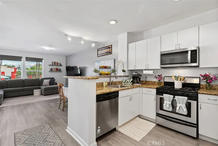 Entry with open concept Kitchen, dining and Living Room - upgraded flooring throughout