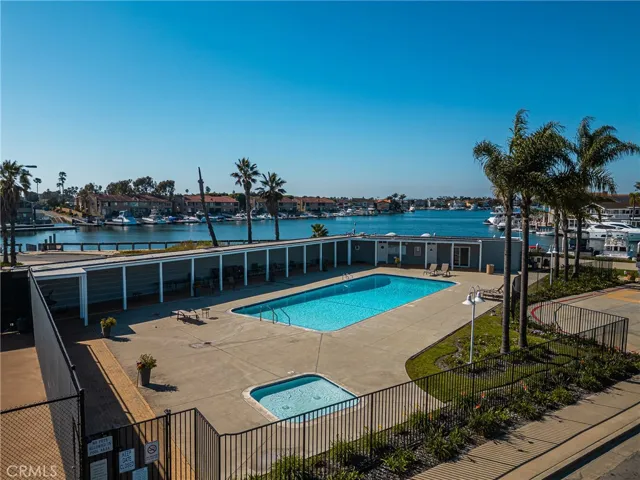 Community includes a spacious pool and hot tub.