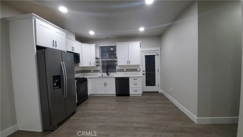 View of kitchen with hallway to the right.