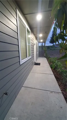 View of front walkway leading to front entry door.