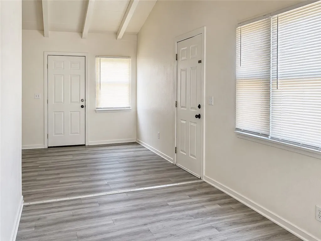 Living room looking towards side exit door