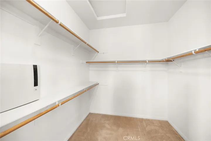 one of the two primary suite closets