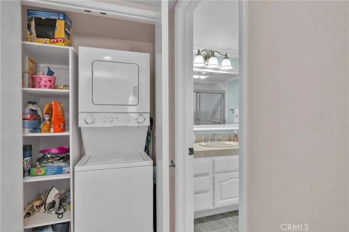 closet with stackable washer and Dryer