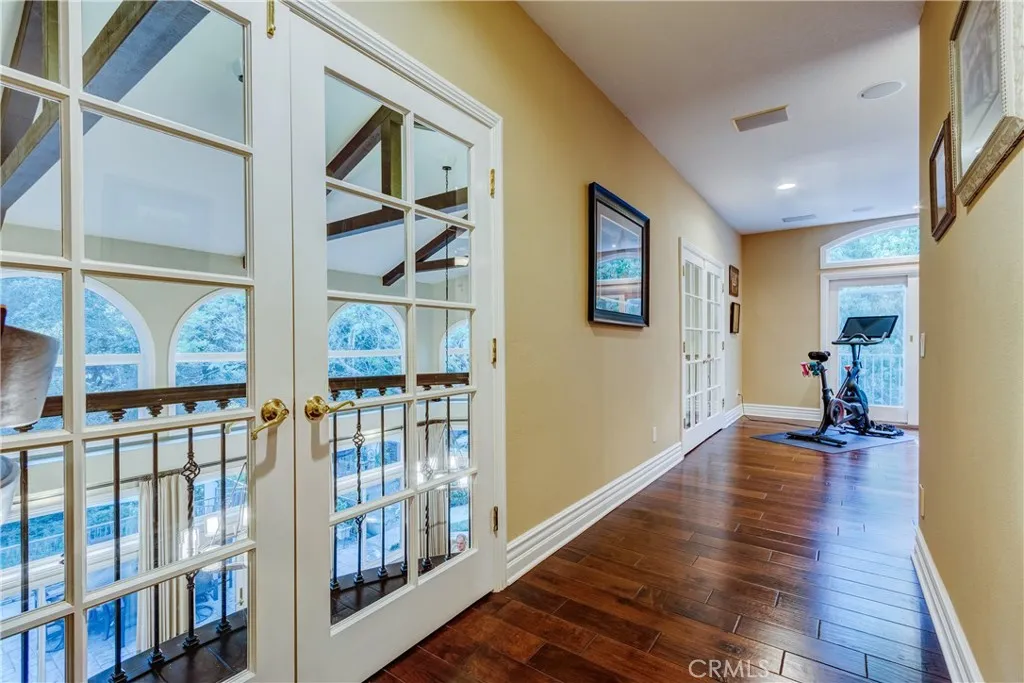 two sets of french doors off all with wrought iron balconies