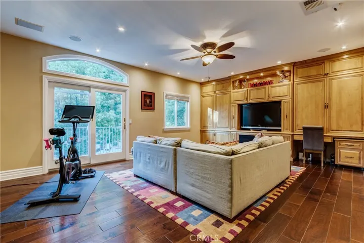 game room with built-in cabinetry