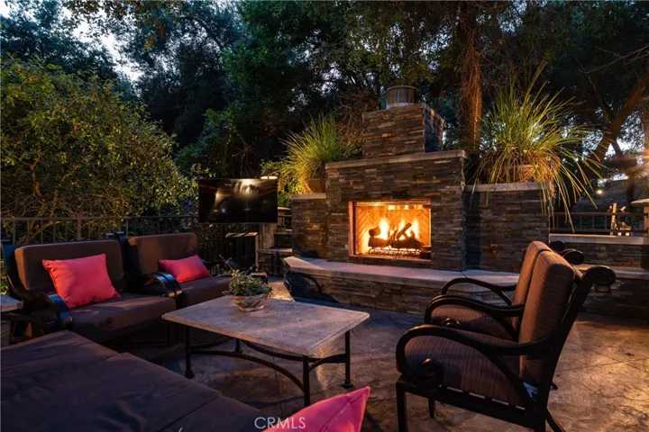 outdoor seating with stone fireplace