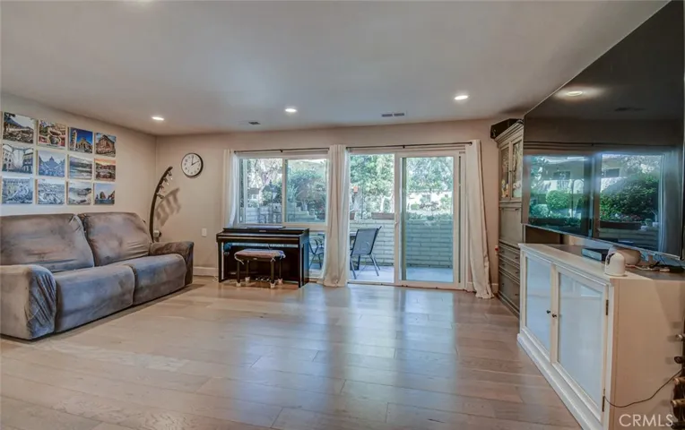 Living room. Note how light/bright the room is, the added canned lighting, and the easy access to the patio
