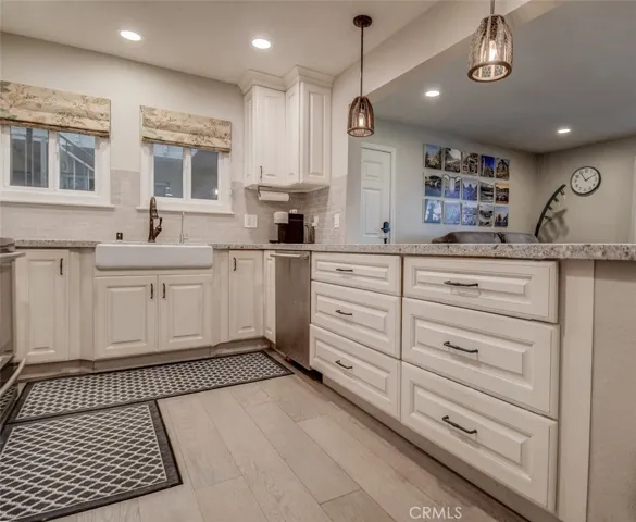 Light, bright kitchen!! Note how the walls have been opened up to the living area