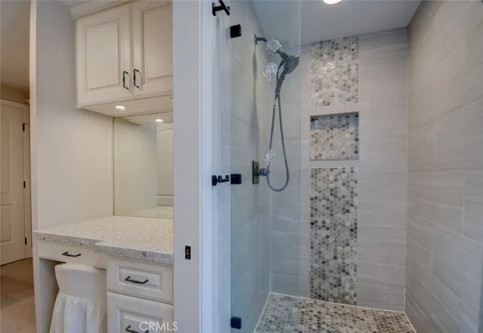 Nicely appointed master shower with multiple upgrades, and glass door