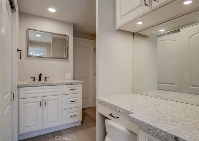 Master vanity with custom lighting, countertops, mirrors and drawers