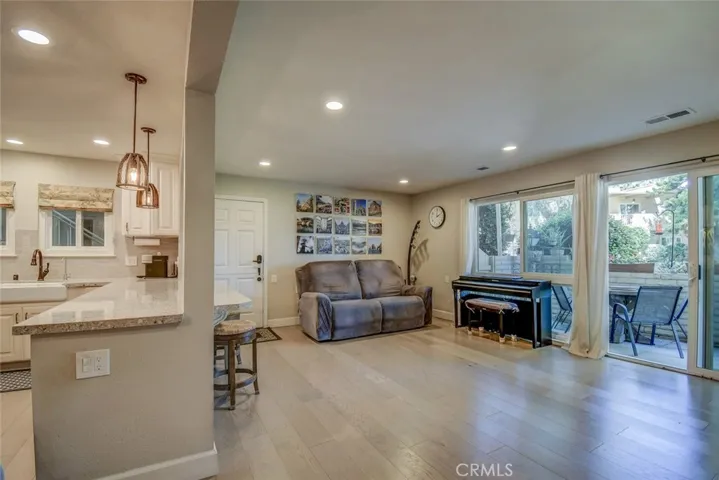 View from dining area to kitchen and living area