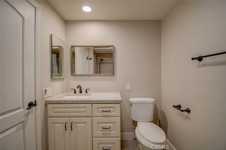 second bath with canned lighting and custom vanity