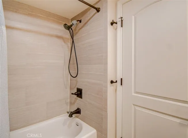 Second bath with tiled tub & custom attachments
