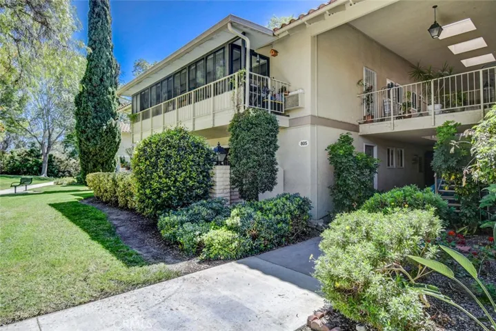 Mature landscaping surrounds patio area. Easy access ground floor unit