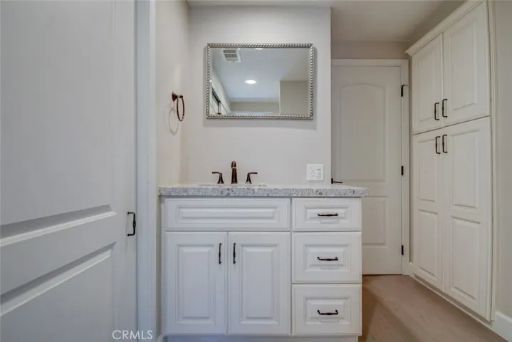 Master sink with many custom features. Note the storage cabinets along the MBR wall