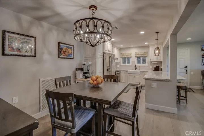 Dining area into kitchen and living area to  the right