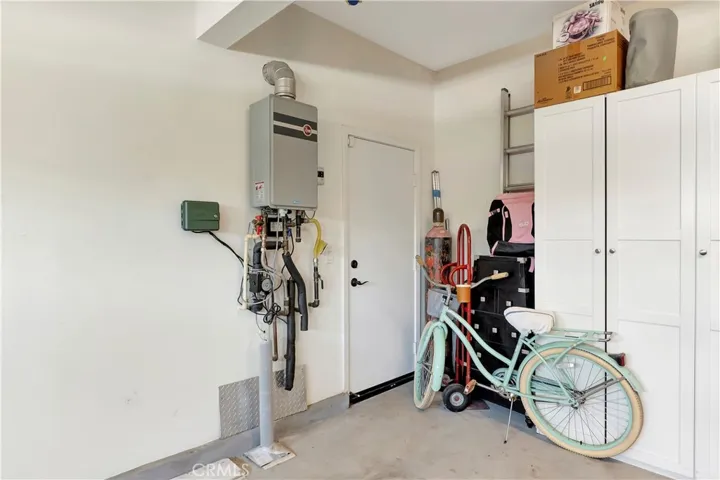 Attached 2 car garage with storage cabinets.